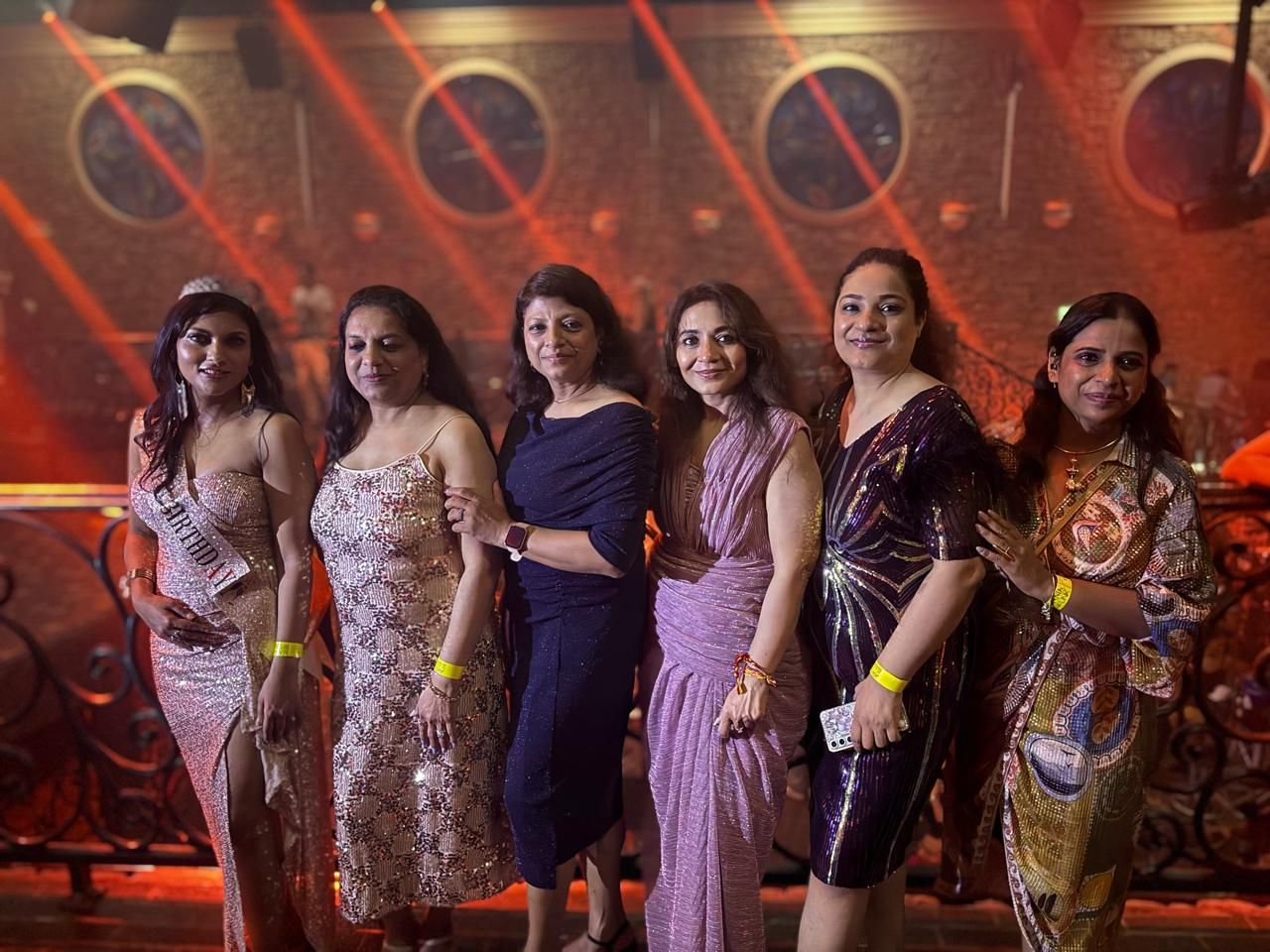 Group photo under the red club lights